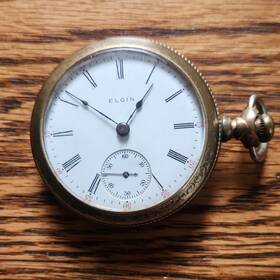 11893468 Elgin Pocket Watch 1905 Grade 309 Copper/brass Colored Case White Dial 7 Jewels