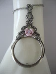 Avon Vintage Silver Tone Magnifying Glass Pendant Necklace With Rose Design. Fixed Price $40.48.