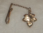 Avon Gold Leaf Attached To Pocket Clip W/chain 3-5/8" (pendant 7/8"). Fixed Price $14.99.