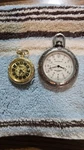 Lucerne Mechanical Goldtone & Coleman Nightsight Silvertone Pocket Watches. Fixed Price $20.00.