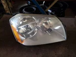 Passenger Headlight Bright Background Fits 05-07 Magnum 160934. Fixed Price $70.00.