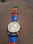 Collezio Quartz Wrist Watch Multicolored Band Rainbow Numbers. Fixed Price $8.99.