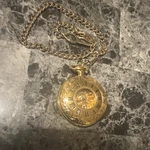 Stauer SG-66523GP Yellow Gold Full Hunter Skeleton Pocket Watch Roman Numerals. Fixed Price $72.00.