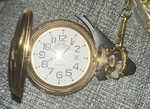 Geneva Gold Eagle Pocket Watch Round White Dial Black Arabic Hours On Chain. Fixed Price $8.00.