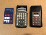 Two Texas Instruments Calculators And One Pocket Solar W/mechanical Pencils. Fixed Price $26.00.